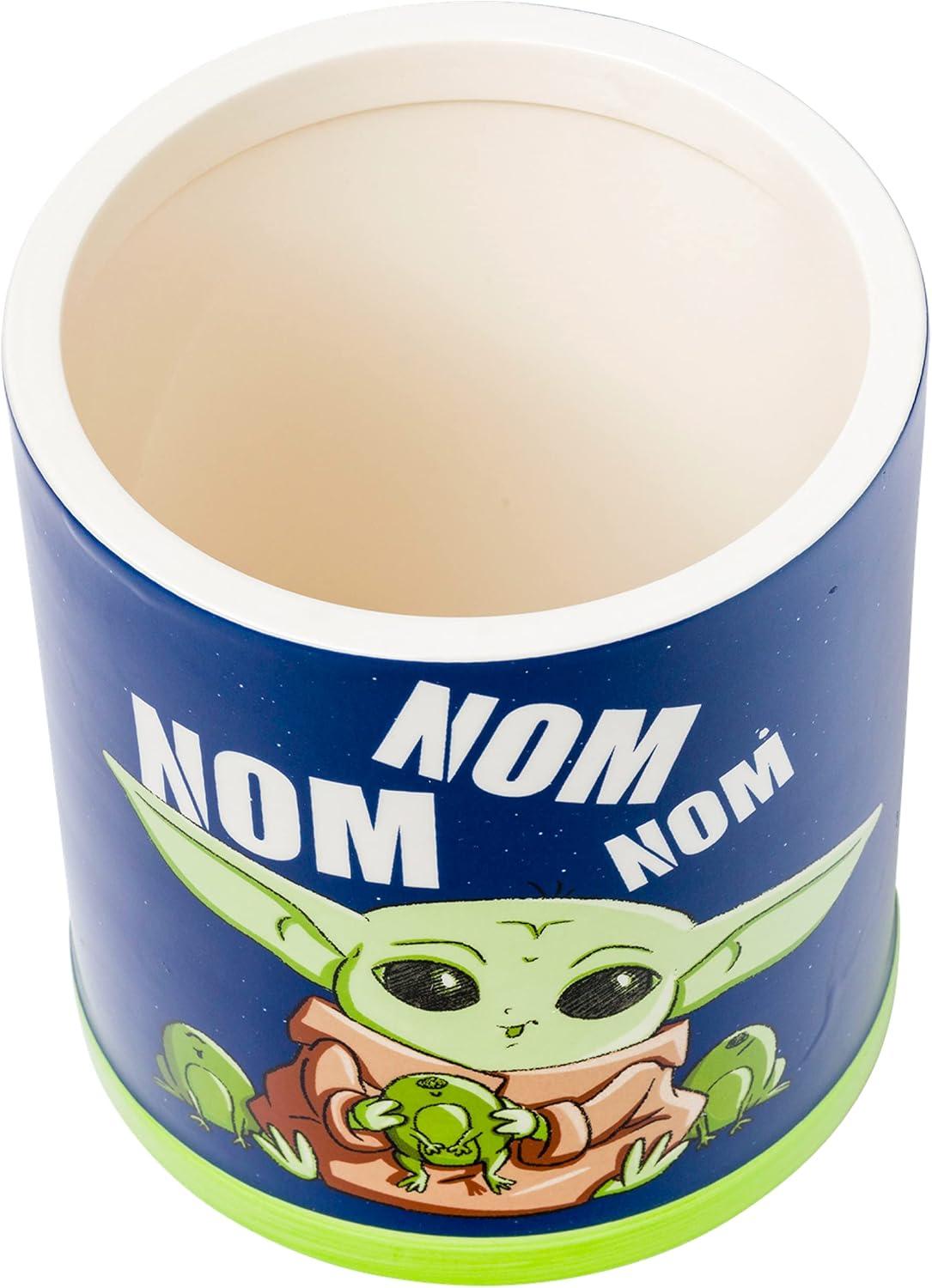imageSilver Buffalo Star Wars The Mandalorian Baby Yoda Grogu Nom Nom The Child Eating Frog Eggs Ceramic Cookie Snack Jar Medium
