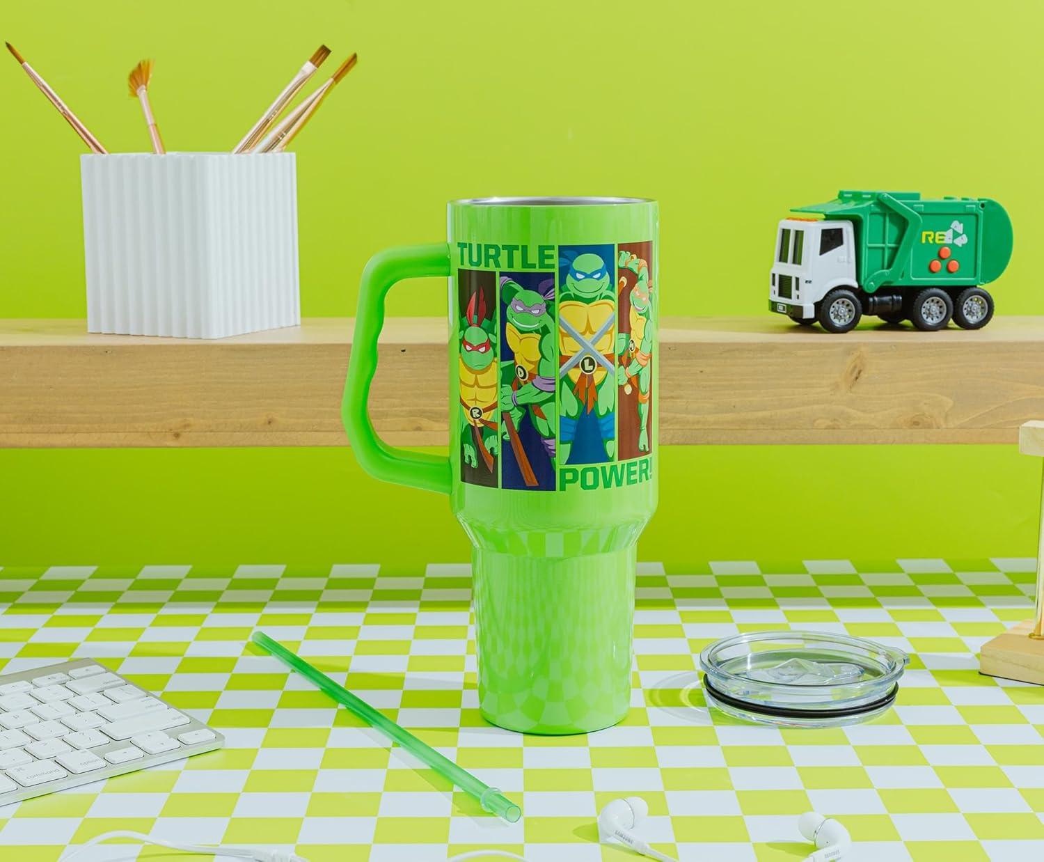 imageSilver Buffalo Teenage Mutant Ninja Turtles Turtle Power Stainless Steel Tumbler with Handle Featuring Leonardo Donatello Raphael and Michelangelo Fits in Standard Cup Holder 40 Ounces