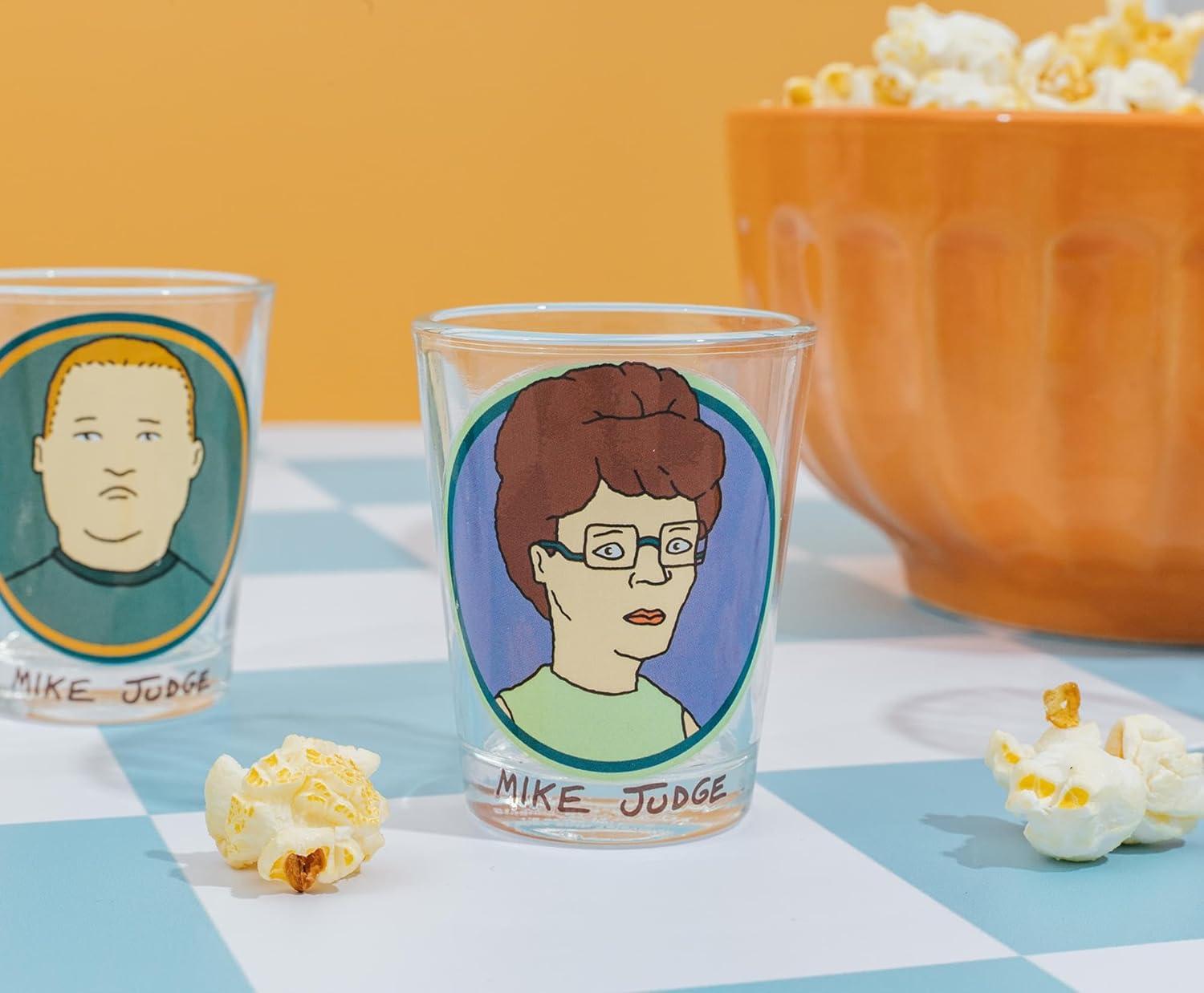 imageSilver Buffalo King of the Hill Character Faces 4 Pack Mini Glass Set Featuring Hank Hill Bobby Hill Peggy Hill and Lady Bird 15 Ounces