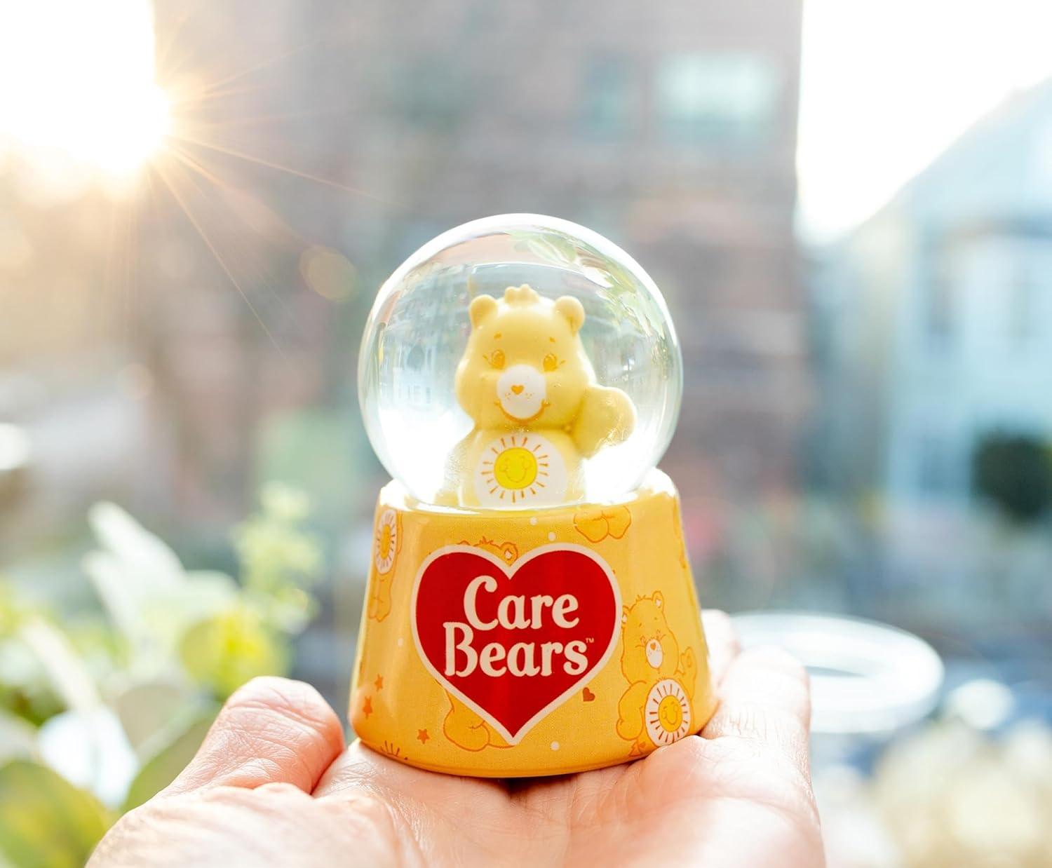 image:imageSilver Buffalo Disney Mickey and Friends Mini Light Up Snow GlobeDaisy Duck38 Inches Tall 45mm SmallCare Bears Funshine Bear